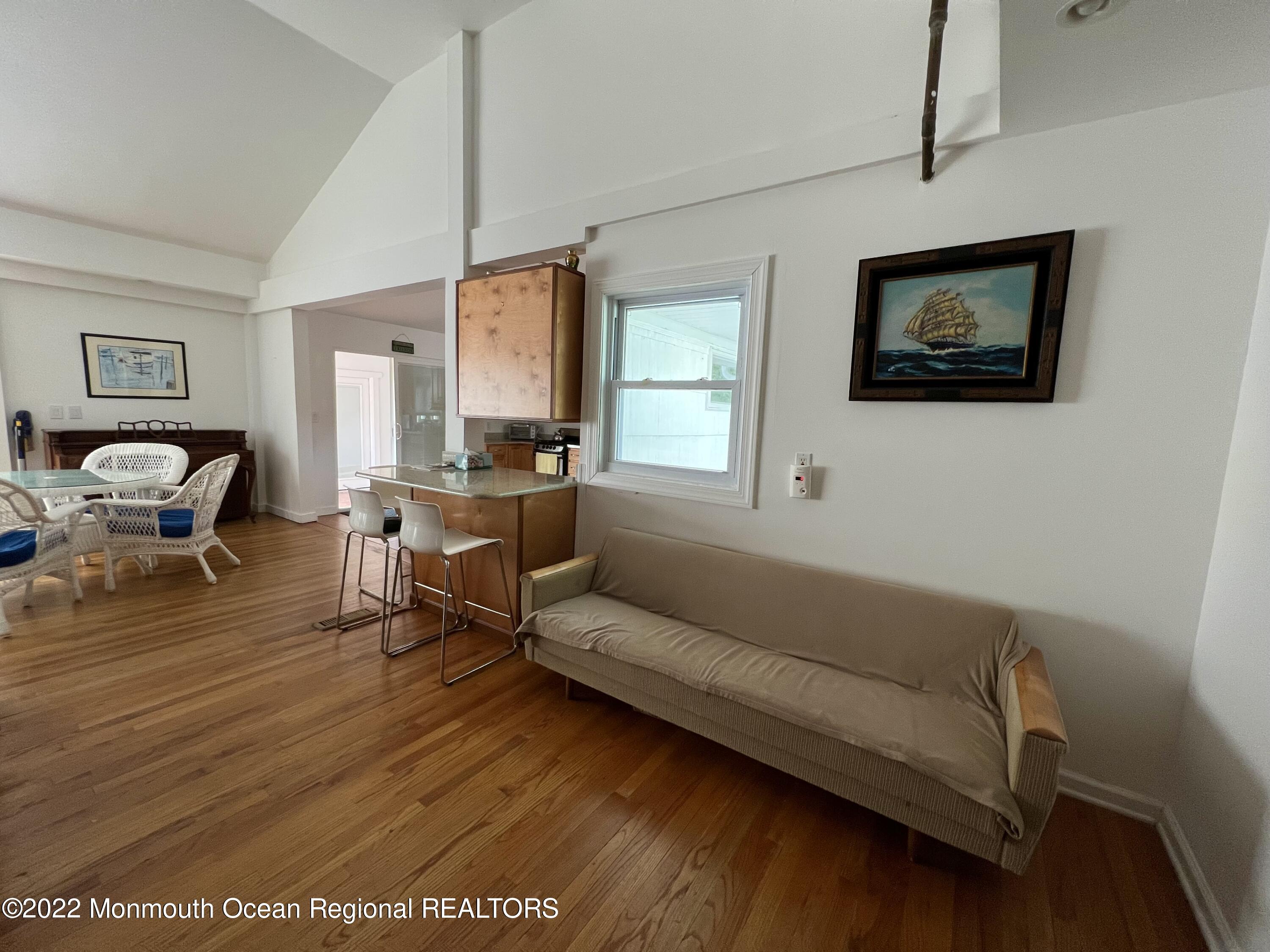 560 Central Avenue, Unit ANNUAL Spring Lake Heights, NJ 07762 - Photo 7 of 14 a living room with furniture and a wooden floor