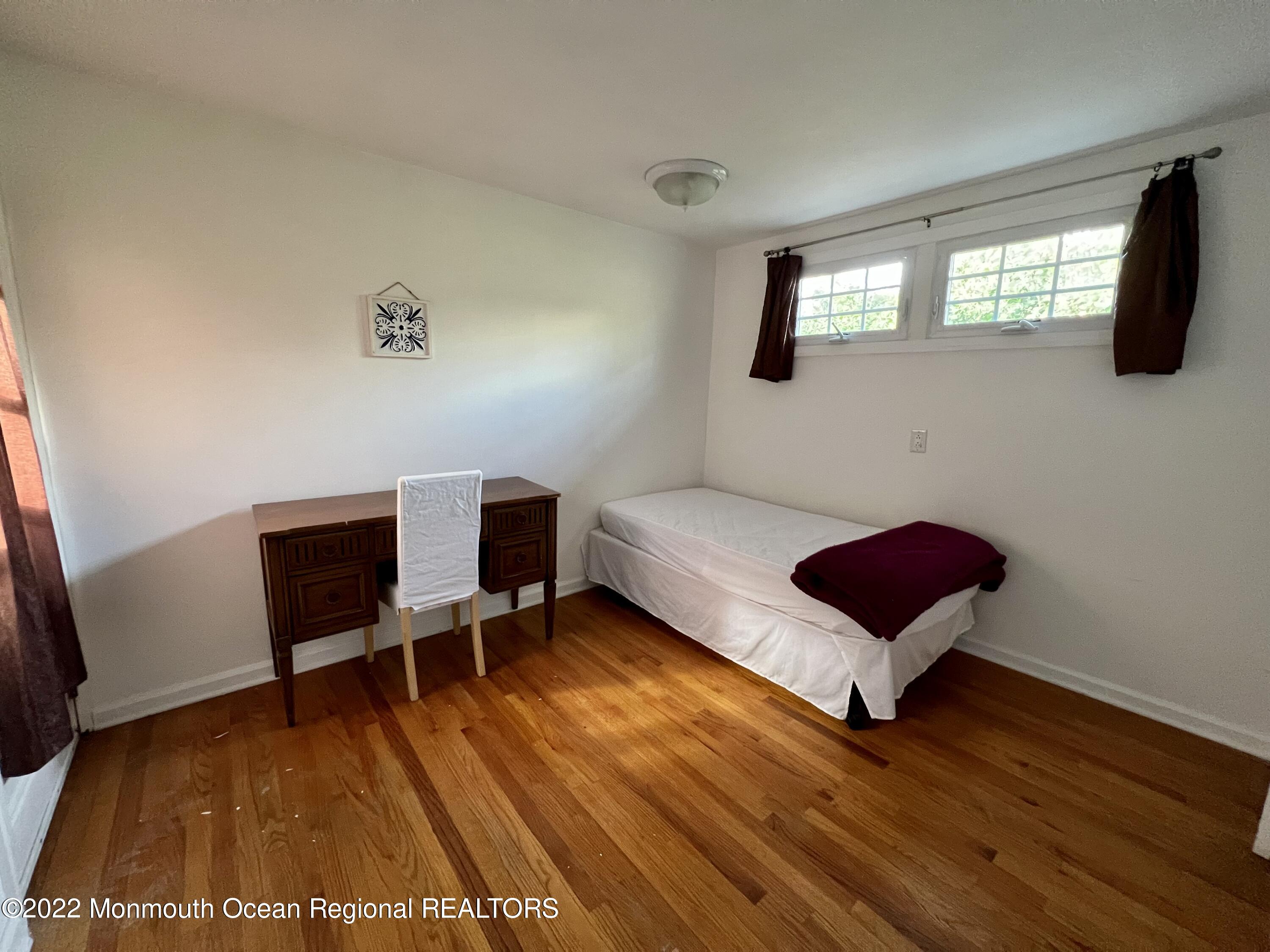 560 Central Avenue, Unit ANNUAL Spring Lake Heights, NJ 07762 - Photo 10 of 14 a living room with furniture and a wooden floor