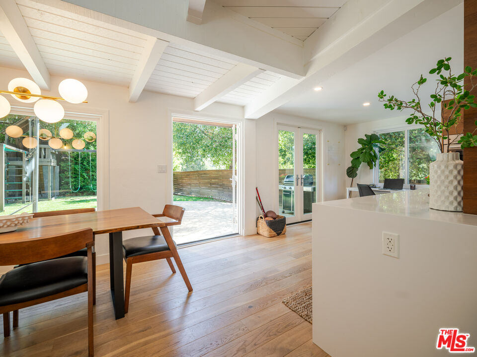 20922 Keller Road Topanga, CA 90290 - Photo 11 of 49 a view of a dining room with furniture and a potted plant