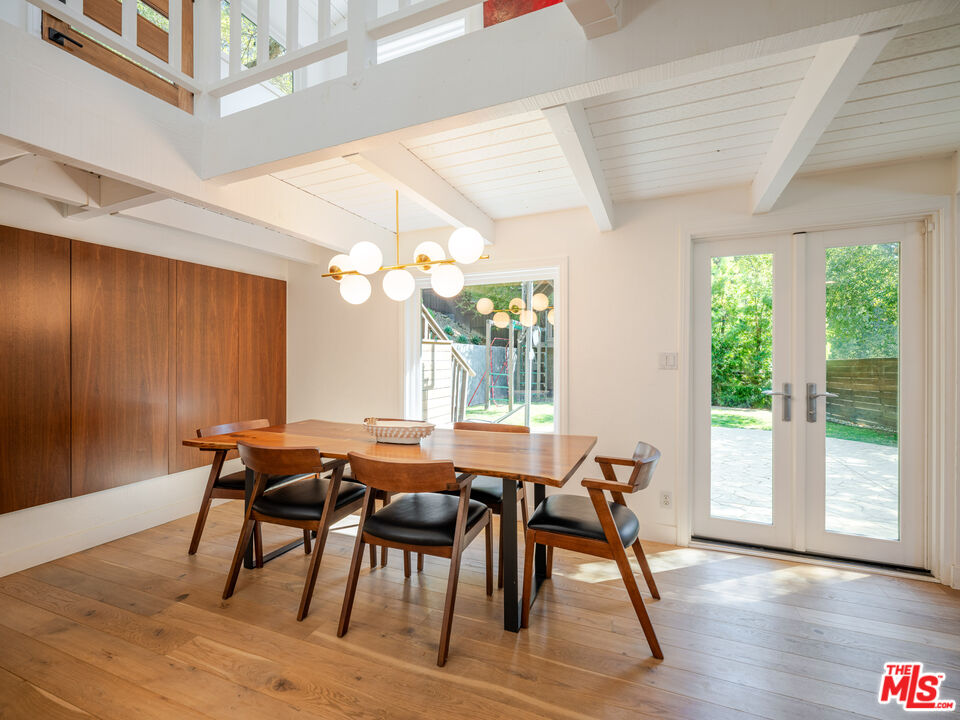 20922 Keller Road Topanga, CA 90290 - Photo 17 of 49 a view of a dining room with furniture and wooden floor