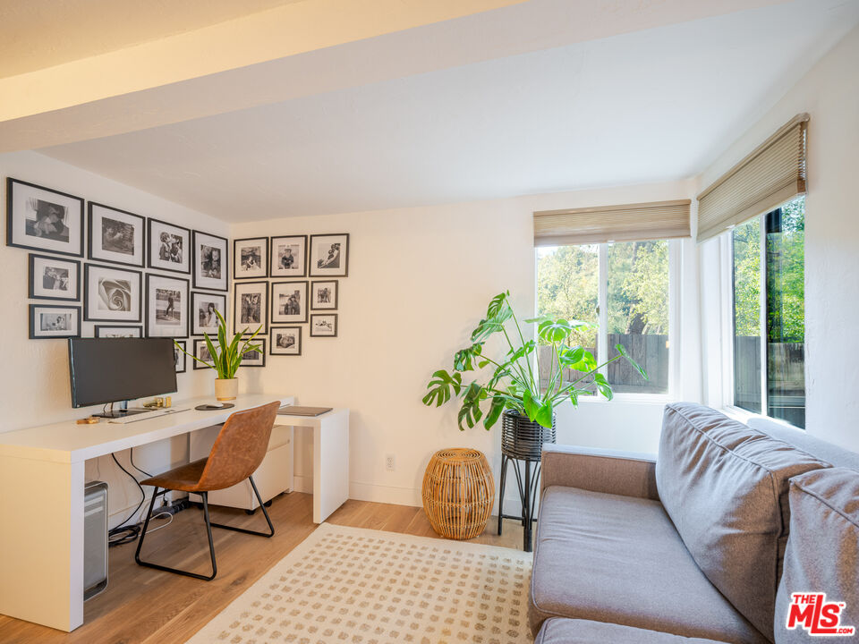 20922 Keller Road Topanga, CA 90290 - Photo 21 of 49 a living room with furniture potted plant and a window