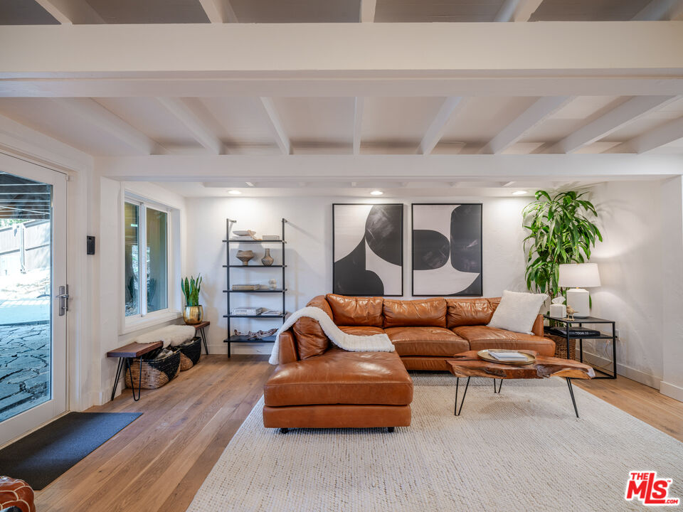20922 Keller Road Topanga, CA 90290 - Photo 25 of 49 a living room with furniture and wooden floor