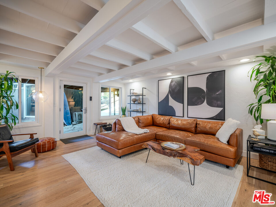 20922 Keller Road Topanga, CA 90290 - Photo 26 of 49 a living room with furniture and a potted plant