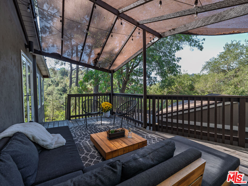 20922 Keller Road Topanga, CA 90290 - Photo 32 of 49 a balcony with furniture and a potted plant