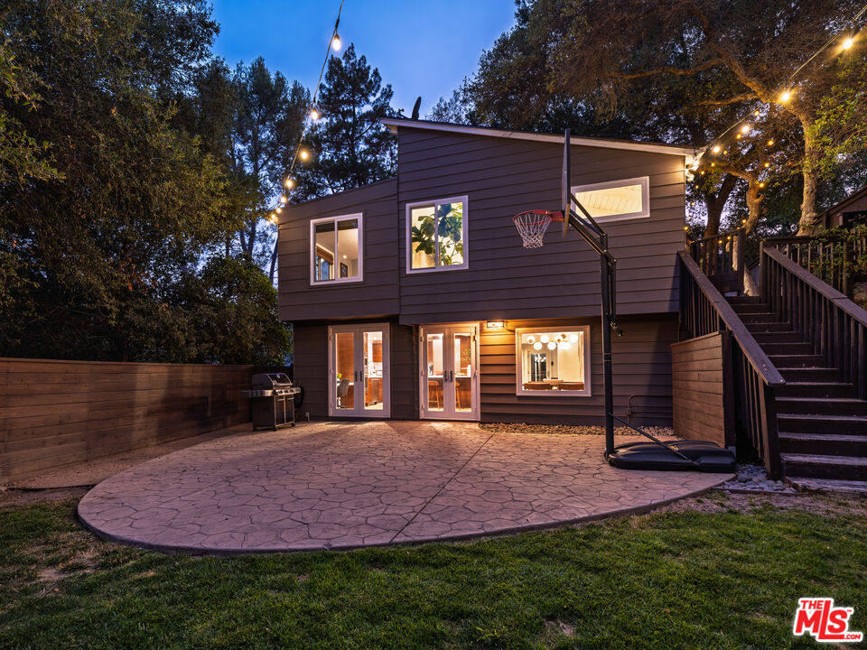 20922 Keller Road Topanga, CA 90290 - Photo 37 of 49 a front view of a house with a yard