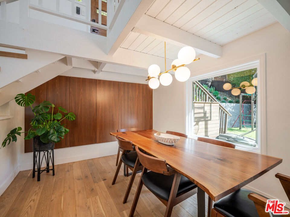20922 Keller Road Topanga, CA 90290 - Photo 5 of 49 a view of a dining room with furniture window and wooden floor