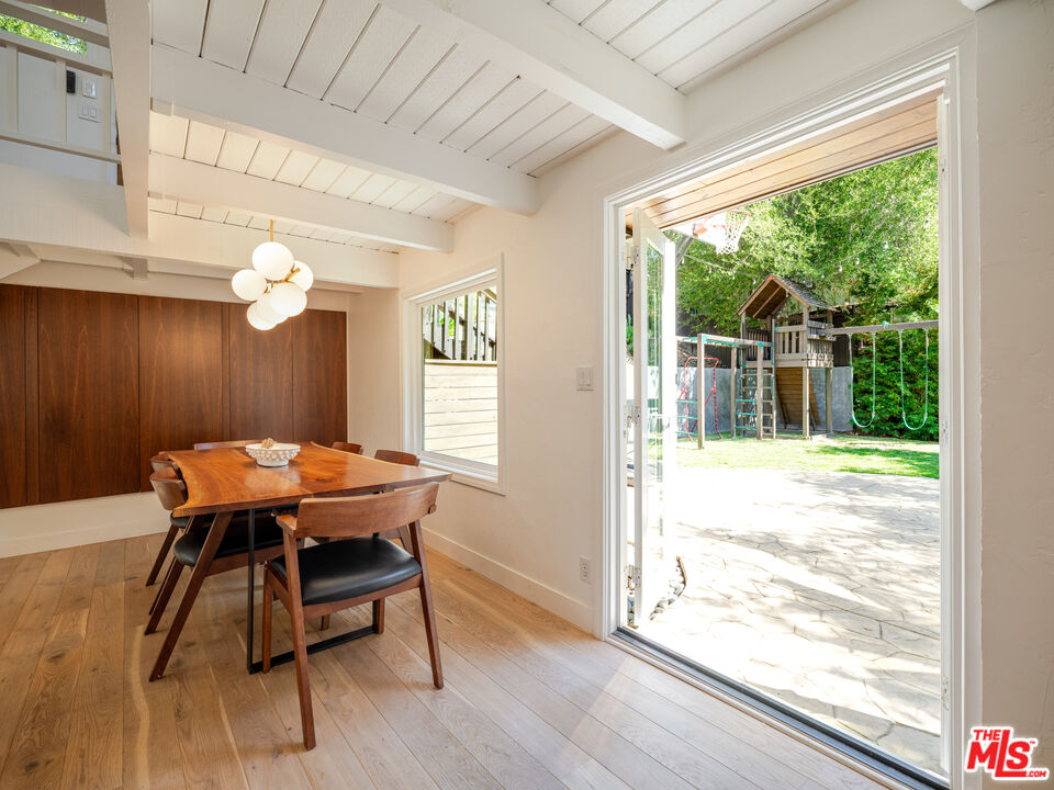 20922 Keller Road Topanga, CA 90290 - Photo 6 of 49 a view of a dining room with furniture window and wooden floor