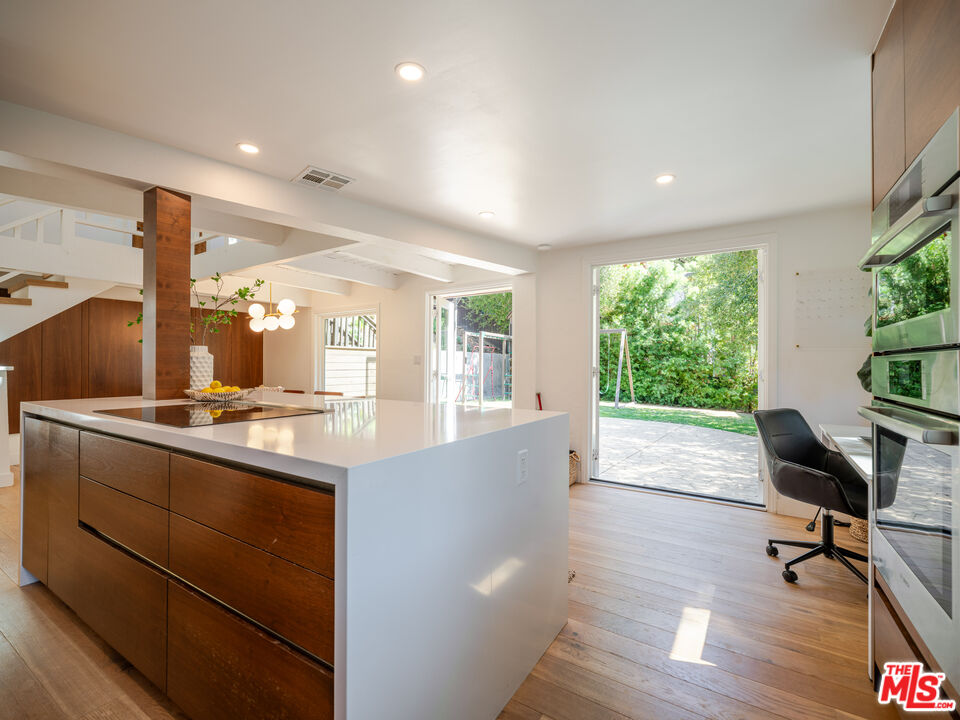 20922 Keller Road Topanga, CA 90290 - Photo 10 of 49 a living room with stainless steel appliances kitchen island furniture and a large window