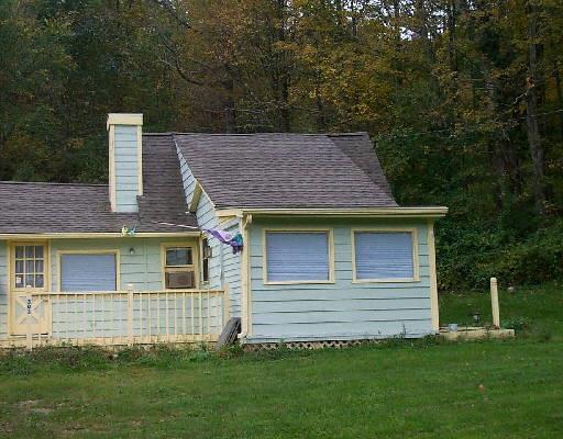 303 Kent Road South Cornwall, CT 06754 - Photo 1 of 1 a backyard of a house with lots of green space