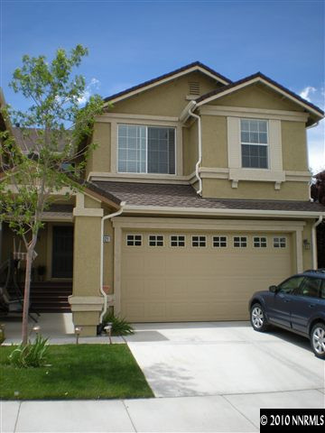 11021 Lamour Lane Reno, NV 89521 - Photo 1 of 9 a front view of a house with a yard