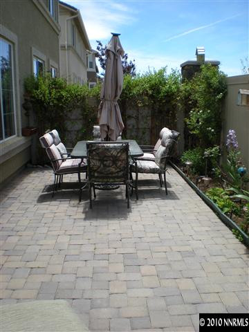 11021 Lamour Lane Reno, NV 89521 - Photo 5 of 9 a view of a patio with a table and chairs