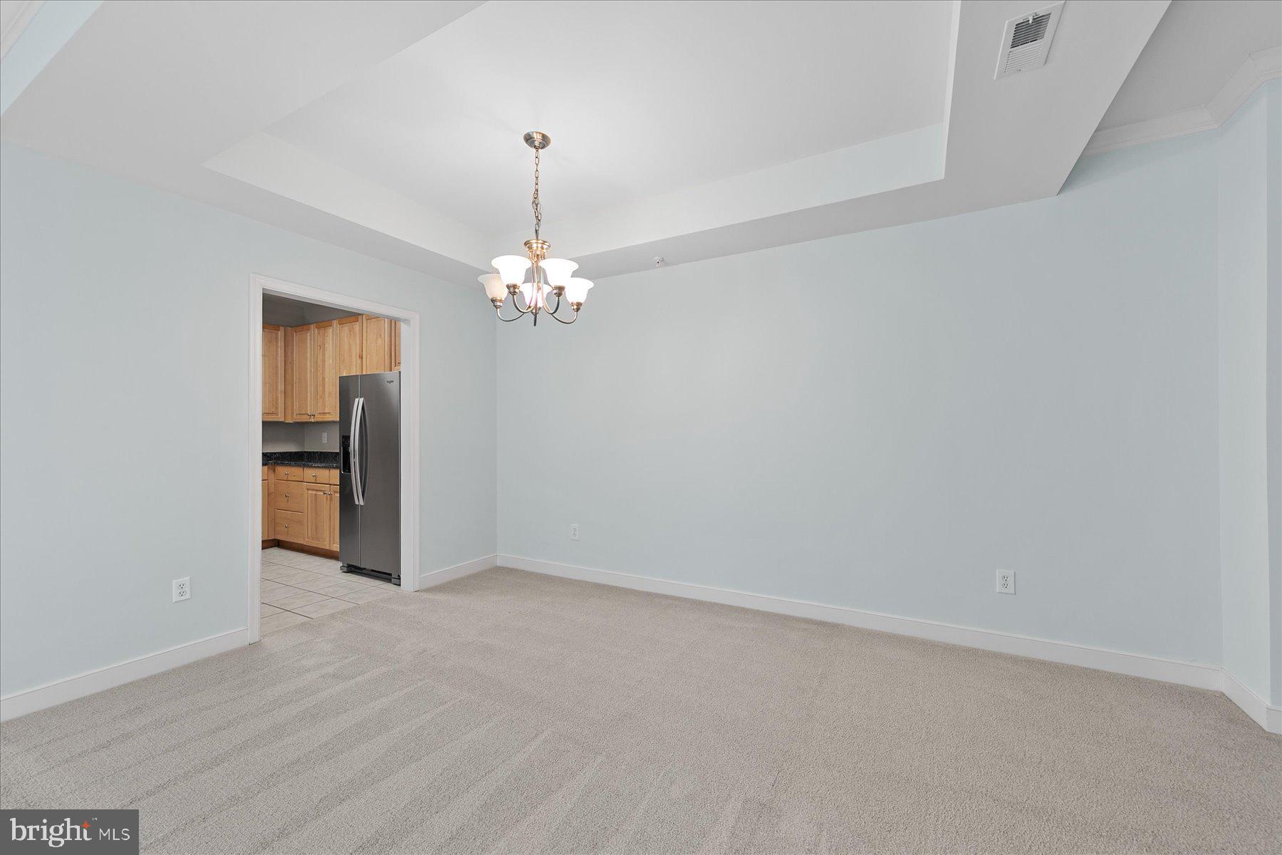 30611 Cedar Neck Road, Unit 2212 Ocean View, DE 19970 - Photo 11 of 29 a view of an empty room with wooden floor and a window