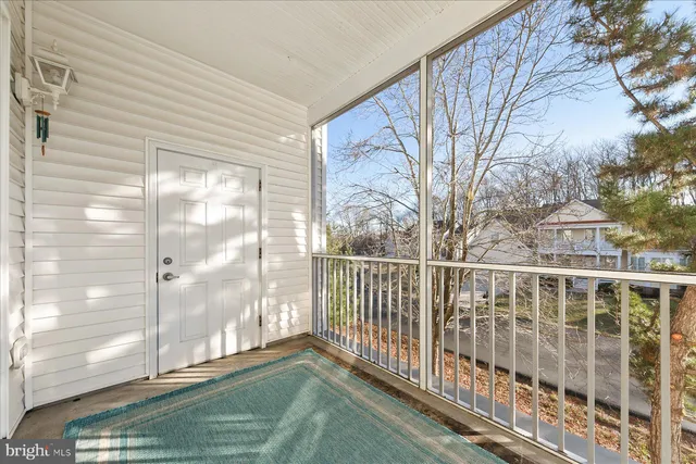 a view of a balcony with wooden floor