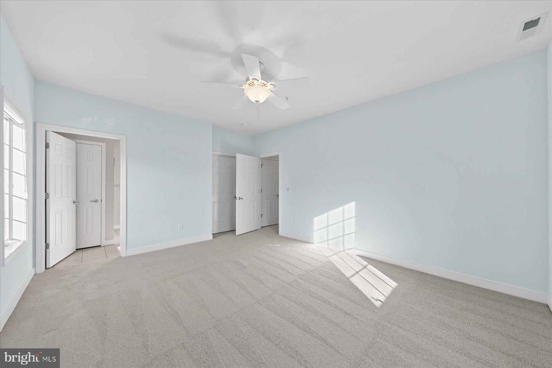 30611 Cedar Neck Road, Unit 2212 Ocean View, DE 19970 - Photo 18 of 29 wooden floor in an empty room with a window