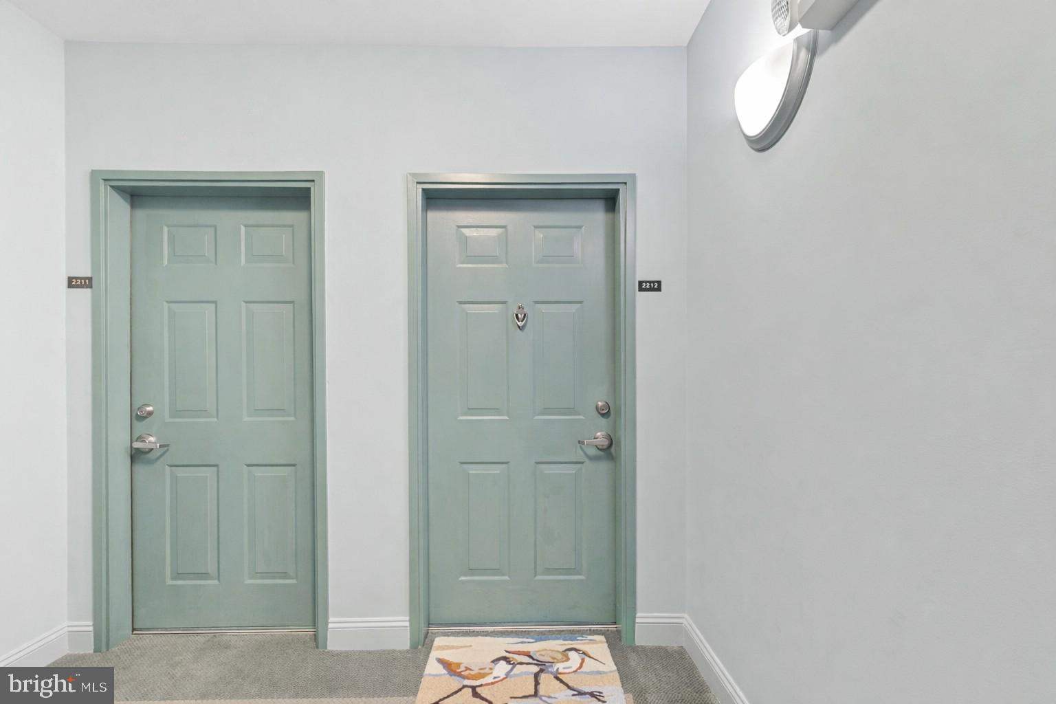 30611 Cedar Neck Road, Unit 2212 Ocean View, DE 19970 - Photo 28 of 29 a bathroom with a glass shower door