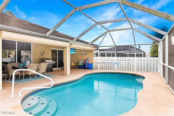 a view of a swimming pool with a patio