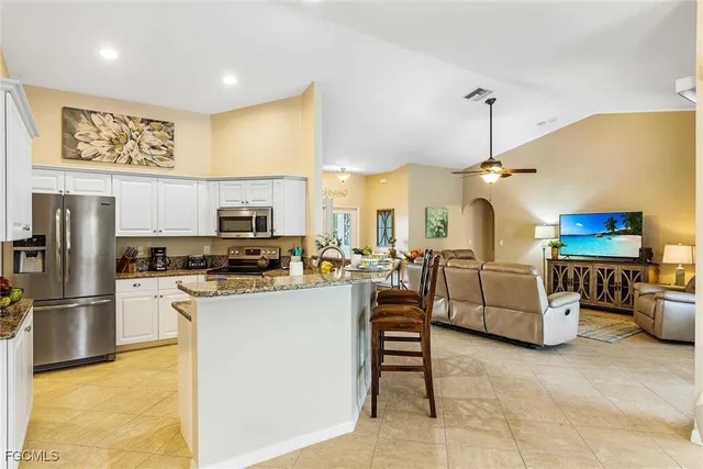 a kitchen with counter top space cabinets and stainless steel appliances