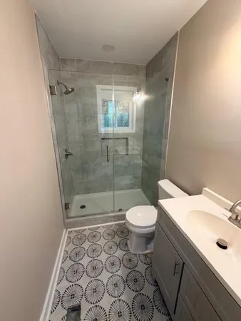 a bathroom with a sink and a shower