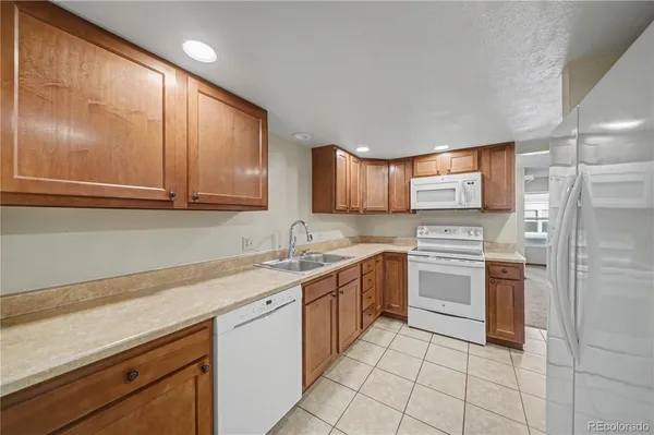 a kitchen with a sink cabinets and stainless steel appliances