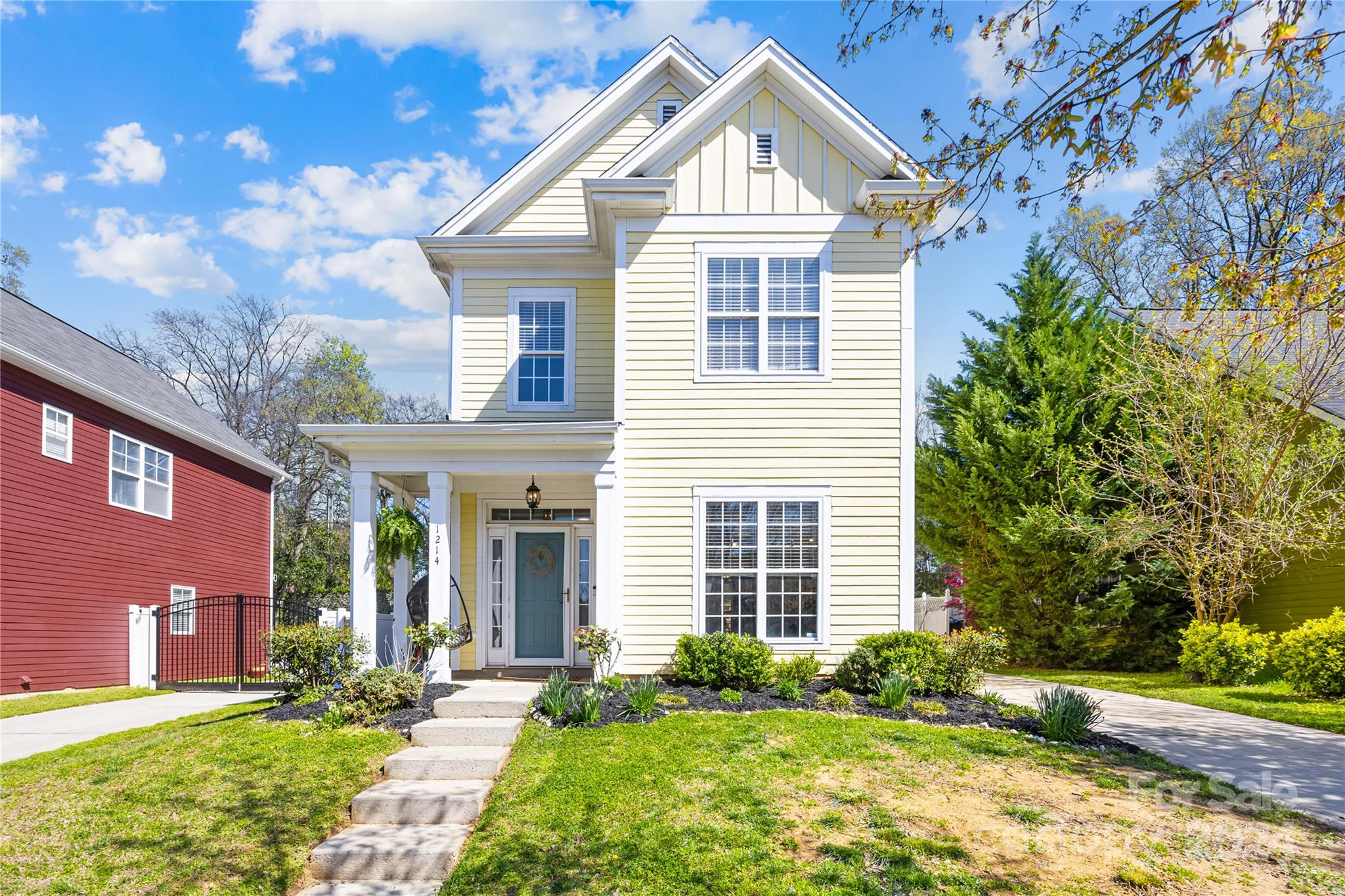 1214 Rising Oak Drive Charlotte, NC 28206 - Photo 2 of 38 a front view of a house with garden