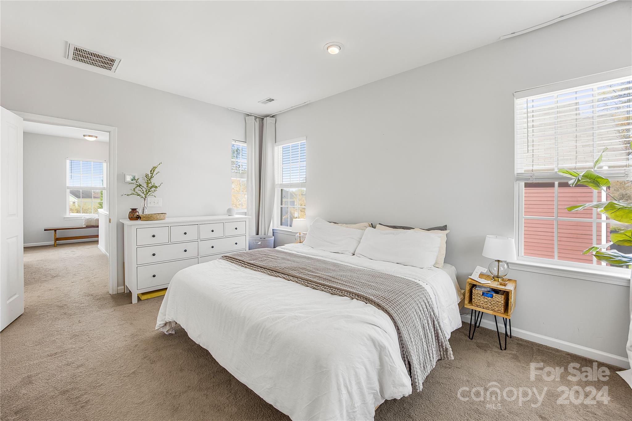 1214 Rising Oak Drive Charlotte, NC 28206 - Photo 22 of 38 a bedroom with a bed and a window