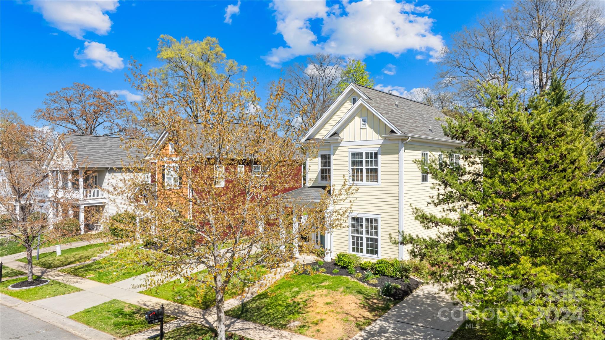 1214 Rising Oak Drive Charlotte, NC 28206 - Photo 26 of 38 a front view of a house with a yard