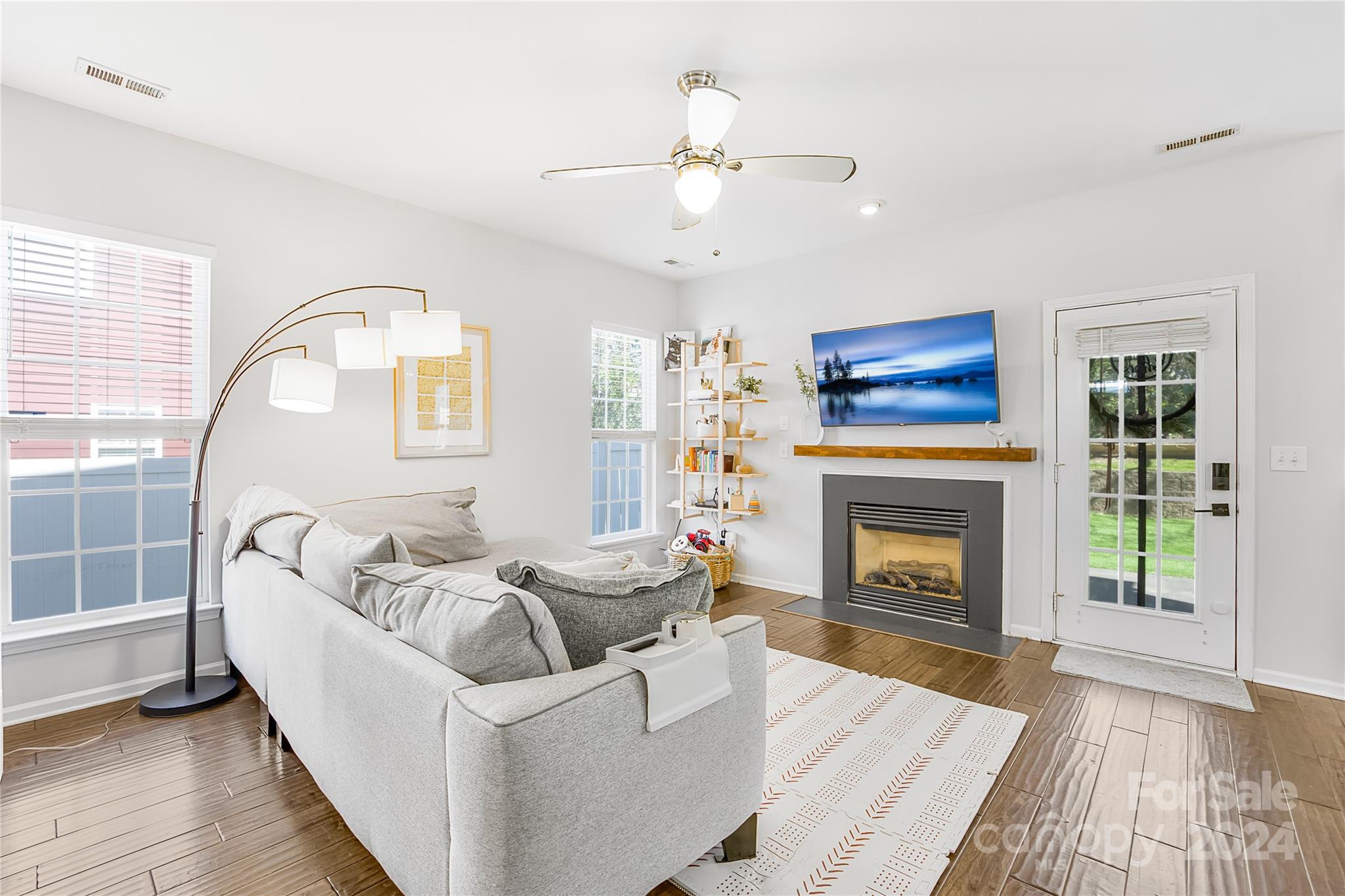 1214 Rising Oak Drive Charlotte, NC 28206 - Photo 6 of 38 a living room with furniture and a fireplace
