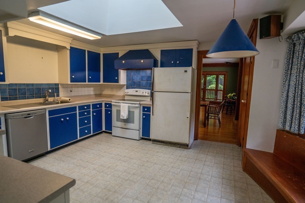 30 Harris Mountain Road Amherst, MA 01002 - Photo 29 of 42 a kitchen with a cabinets a sink and a refrigerator