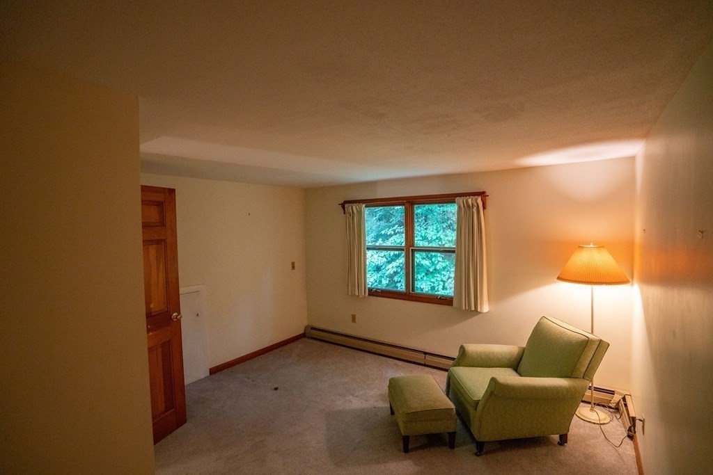 30 Harris Mountain Road Amherst, MA 01002 - Photo 32 of 42 a living room with furniture and a window