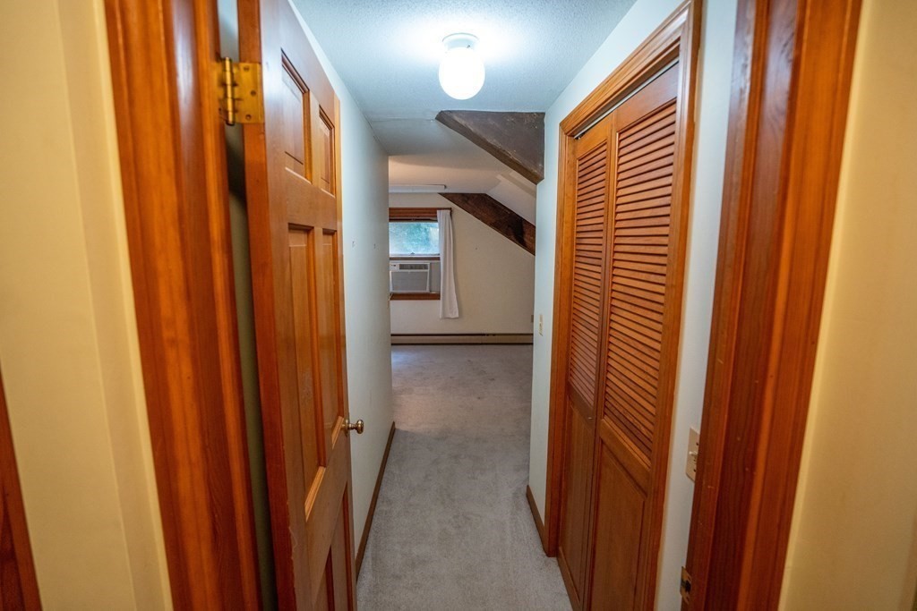 30 Harris Mountain Road Amherst, MA 01002 - Photo 37 of 42 a view of a hallway with a door