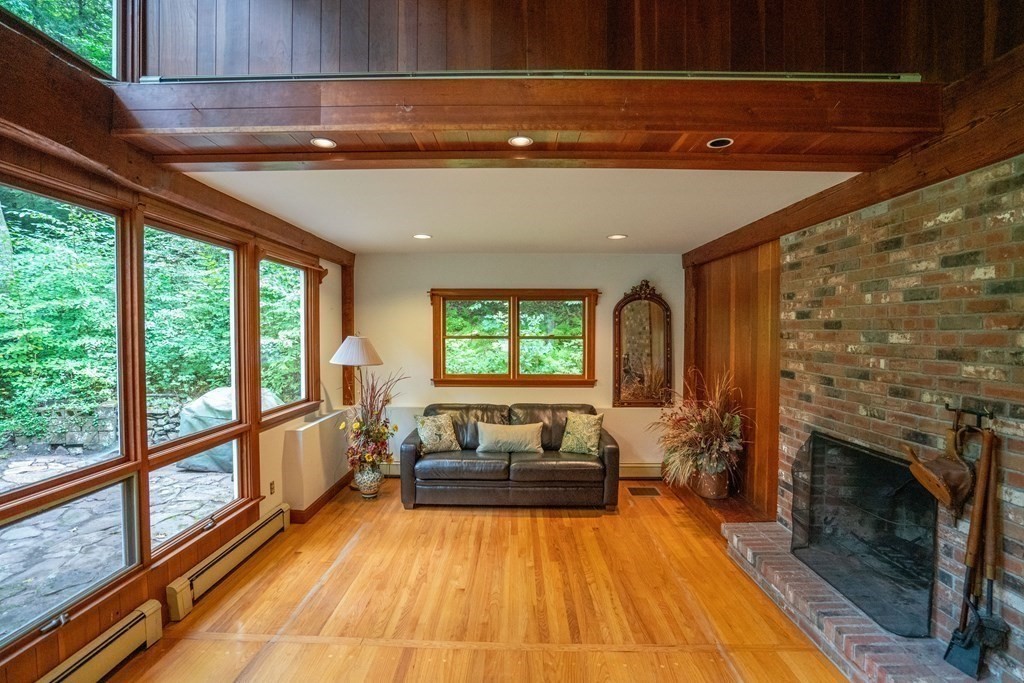 30 Harris Mountain Road Amherst, MA 01002 - Photo 8 of 42 a living room with furniture and a fireplace