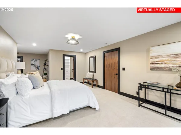 a kitchen with stainless steel appliances kitchen island granite countertop a stove a sink and a refrigerator