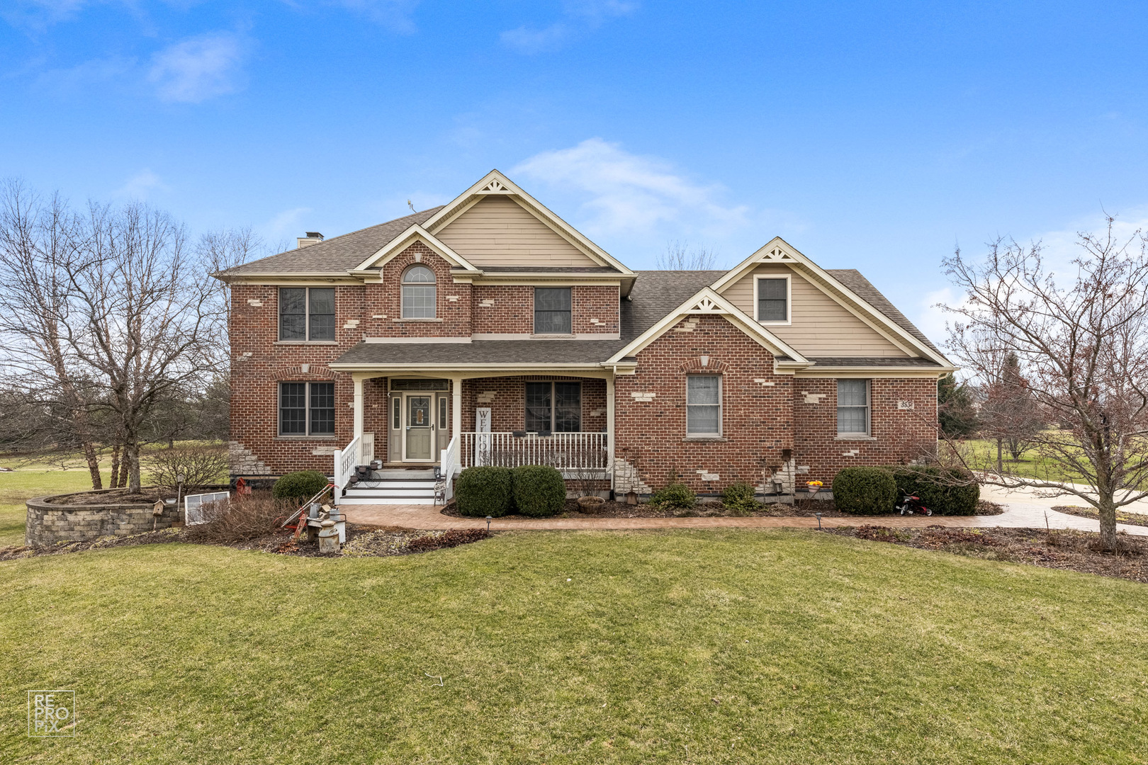 a front view of a house with a yard