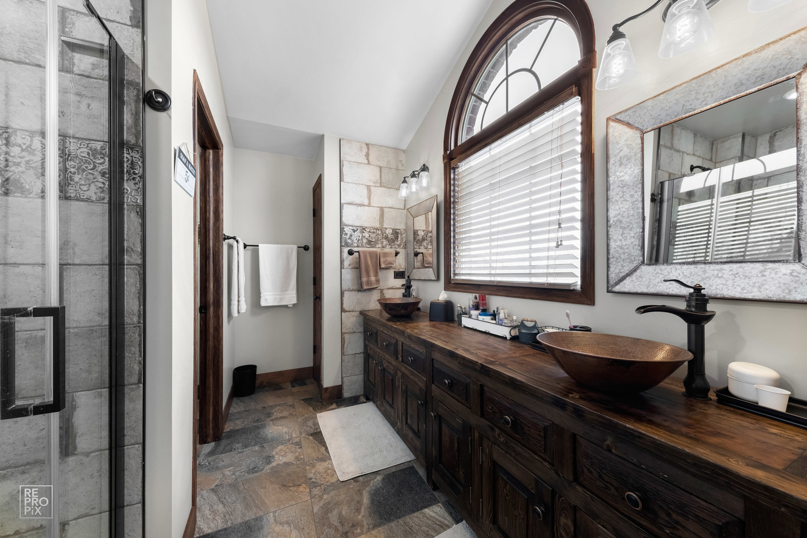 355 Meadow View Burlington, IL 60109 - Photo 15 of 37 a spacious bathroom with a granite countertop sink a mirror a and a shower
