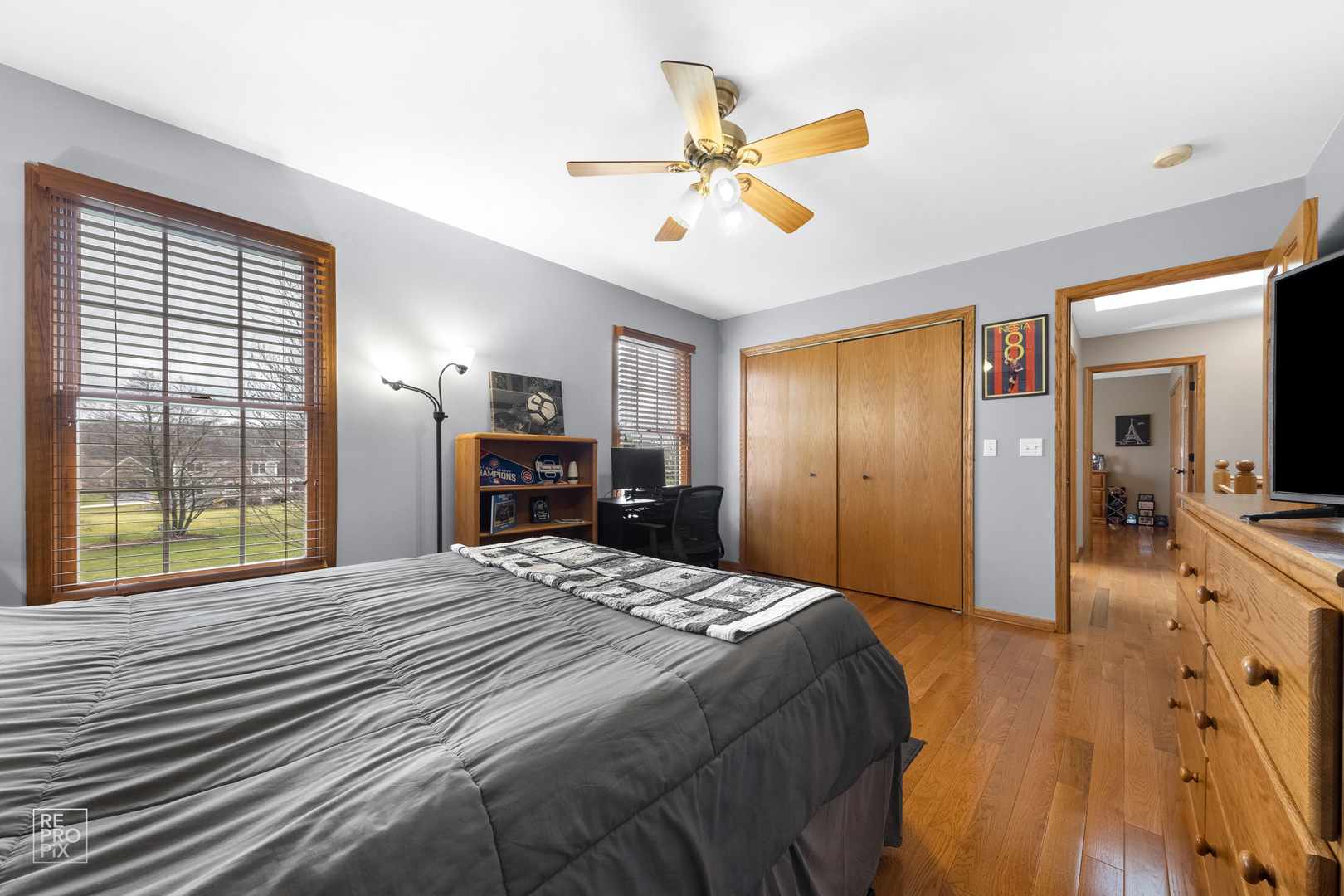 355 Meadow View Burlington, IL 60109 - Photo 18 of 37 a bedroom with a bed and a large mirror with a flat tv screen