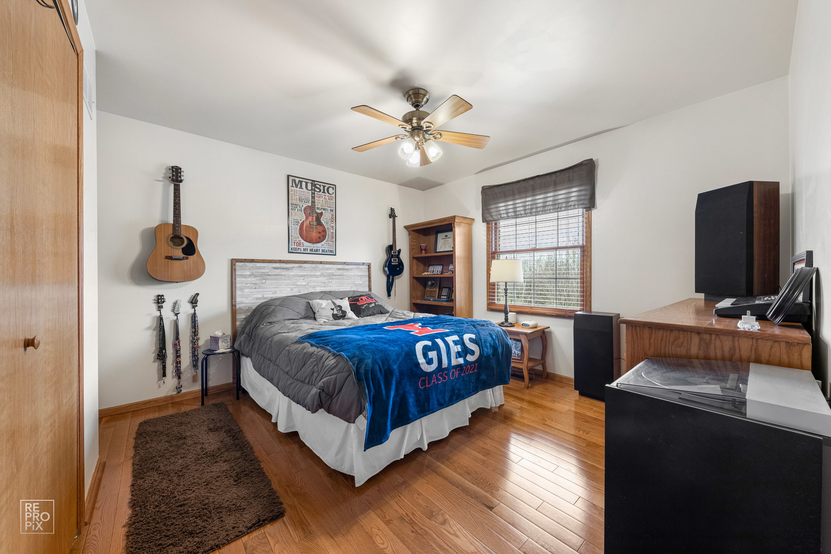 355 Meadow View Burlington, IL 60109 - Photo 21 of 37 a bedroom with a bed and a flat screen tv