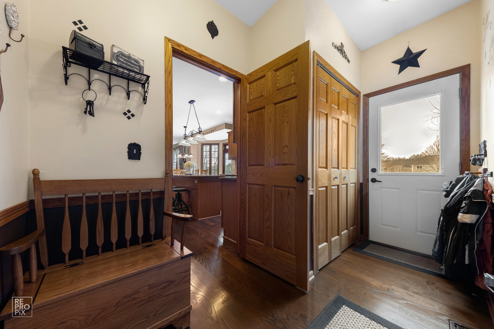 355 Meadow View Burlington, IL 60109 - Photo 27 of 37 a view of a hallway with wooden floor and windows