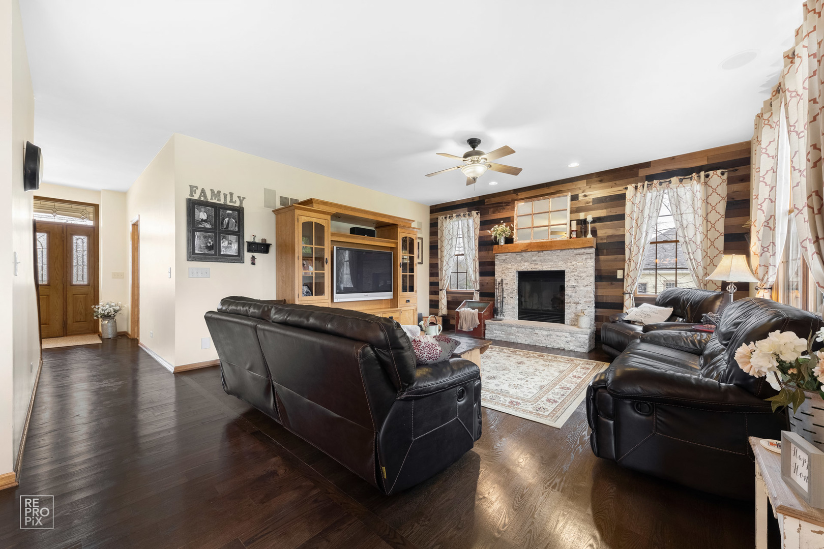 355 Meadow View Burlington, IL 60109 - Photo 3 of 37 a living room with furniture flat screen tv and a fireplace
