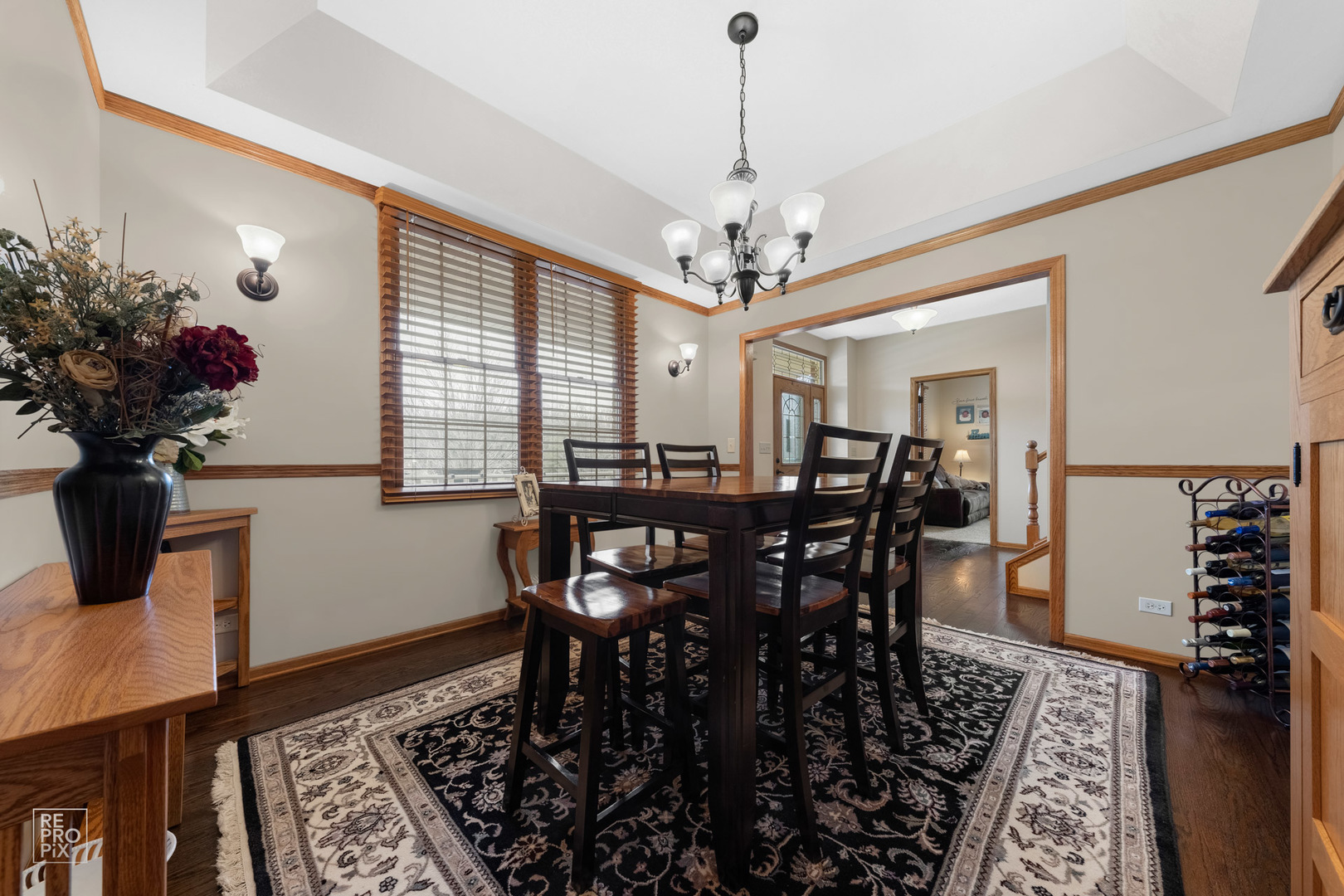 355 Meadow View Burlington, IL 60109 - Photo 8 of 37 a view of a dining room with furniture and a chandelier