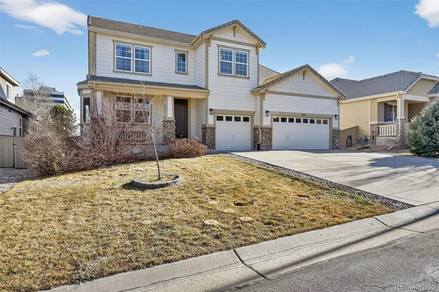 a front view of a house with yard