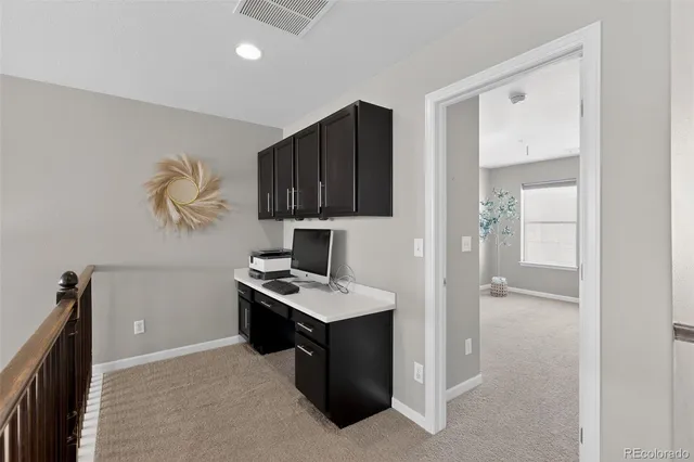 a view of kitchen with cabinets and wooden floor