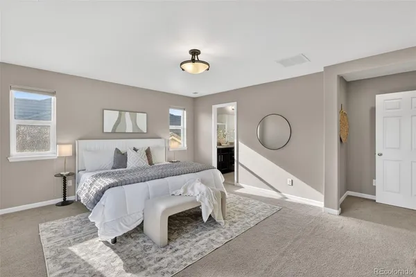 a bed room with a bed and a chandelier