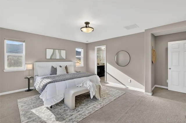 a bed room with a bed and a chandelier