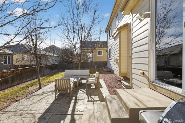 a view of a balcony with wooden floor and furniture
