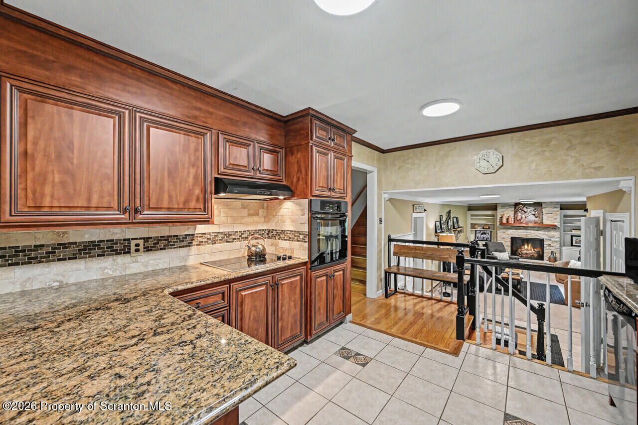 121 T Rt 351 Moscow, PA 18444 - Photo 25 of 79 a kitchen with stainless steel appliances granite countertop a sink and cabinets