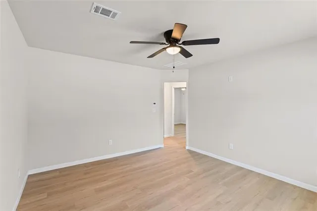a view of a big room with wooden floor