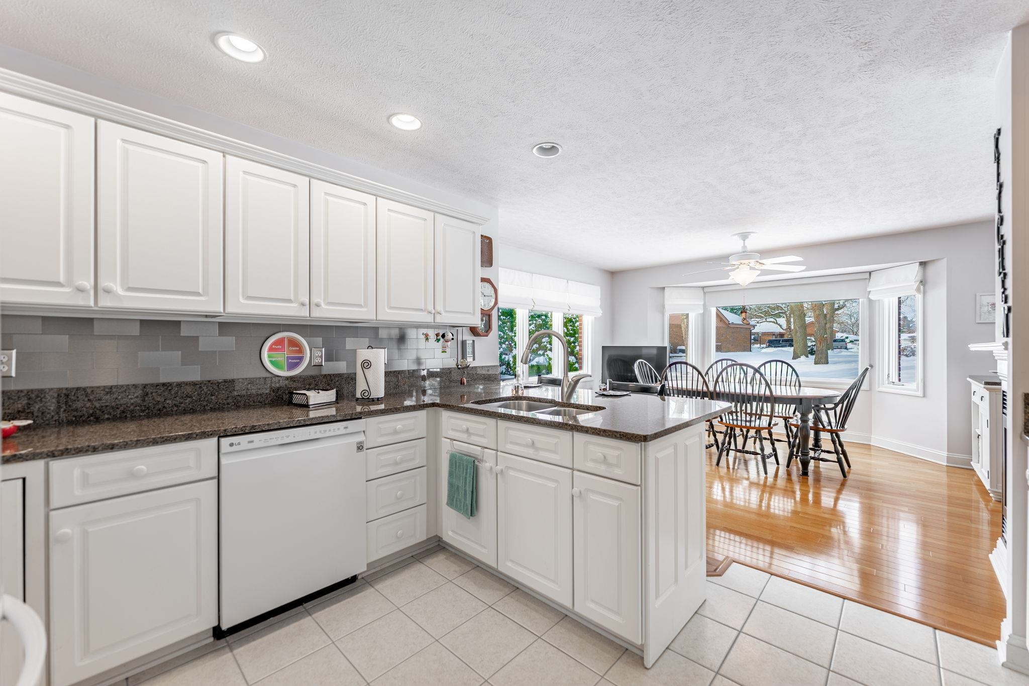 225 Secretariat's Way Belvidere, IL 61008 - Photo 13 of 41 a kitchen with stainless steel appliances granite countertop a sink and cabinets