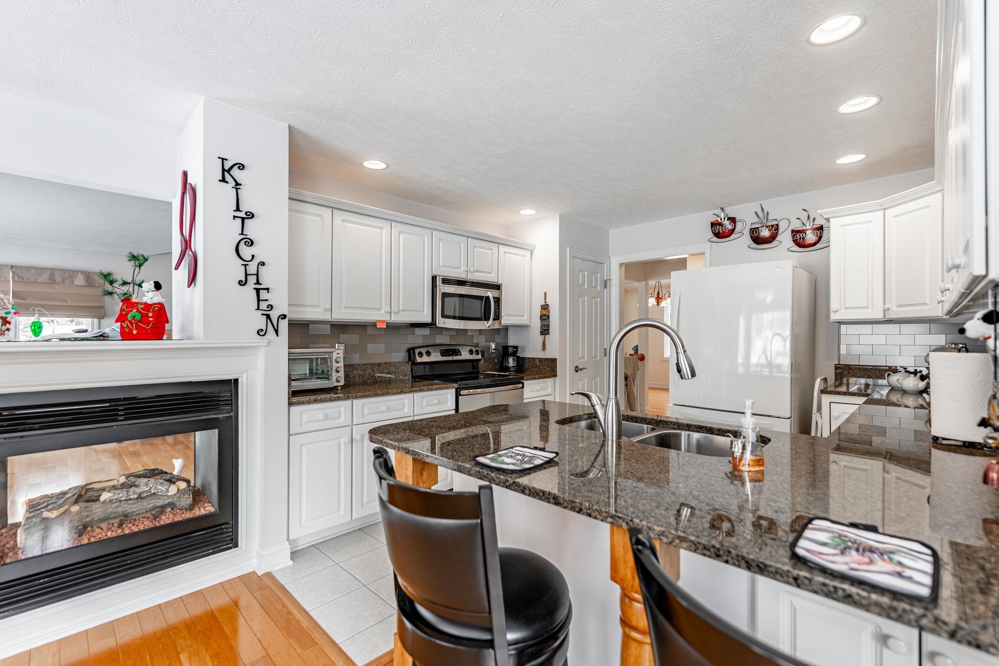 225 Secretariat's Way Belvidere, IL 61008 - Photo 14 of 41 a kitchen with refrigerator and cabinets
