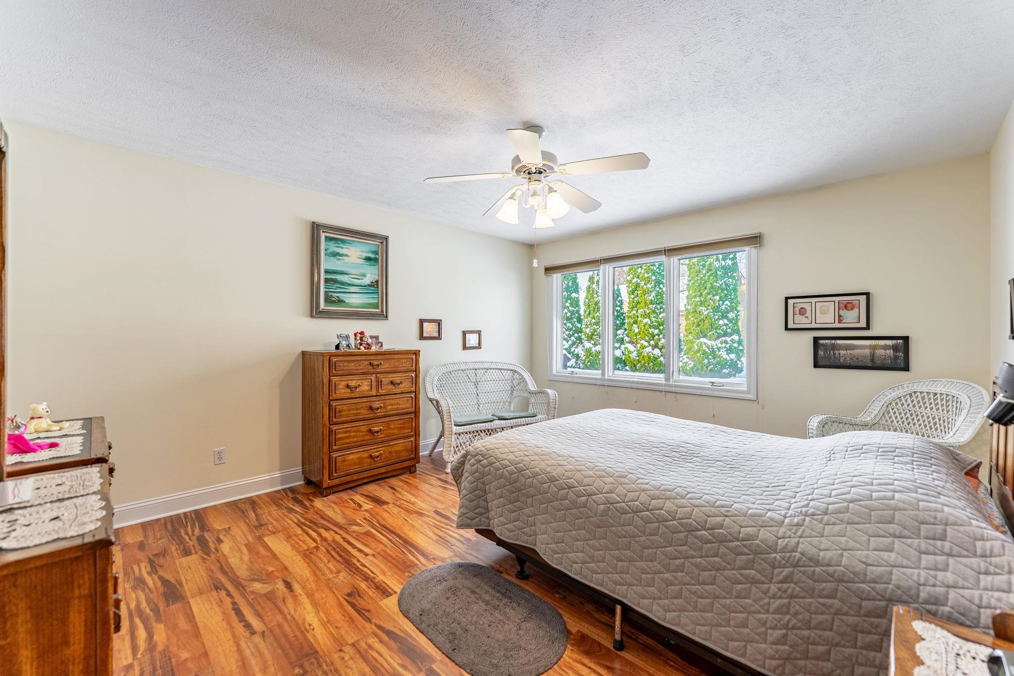 225 Secretariat's Way Belvidere, IL 61008 - Photo 16 of 41 a bedroom with a bed and a chandelier