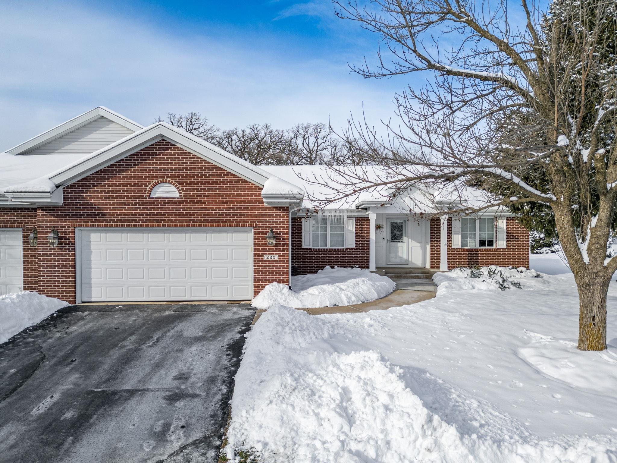 225 Secretariat's Way Belvidere, IL 61008 - Photo 2 of 41 a front view of a house with a yard and garage